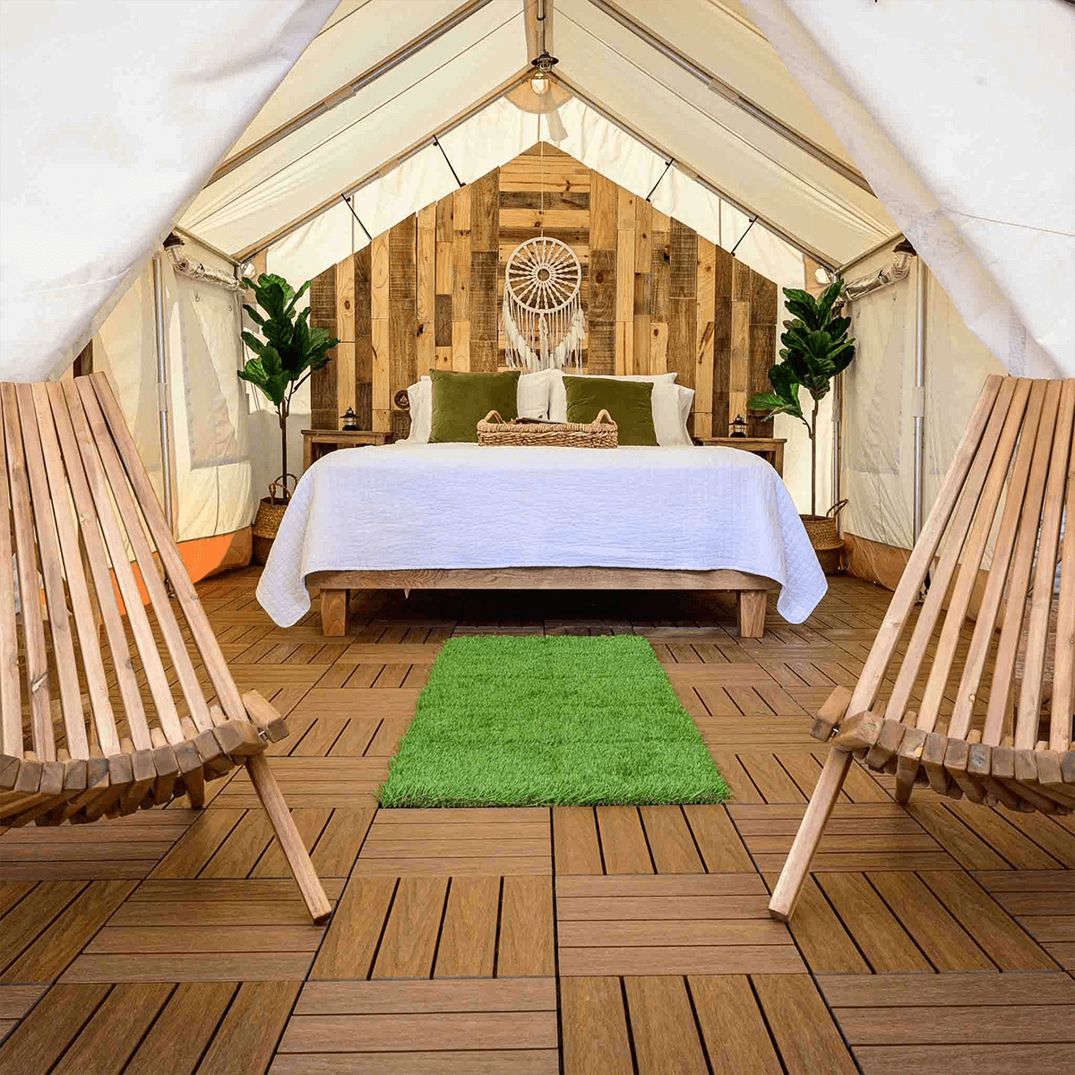 alpha wall tent all set up for glamping with a bed inside