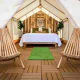 alpha wall tent all set up for glamping with a bed inside