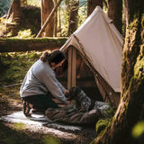 woman and dog enjoying camping with mini regatta bell tent