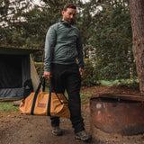 Boat-Shape-Canvas-Firewood-Log-Carrier-tan being carried outdoors