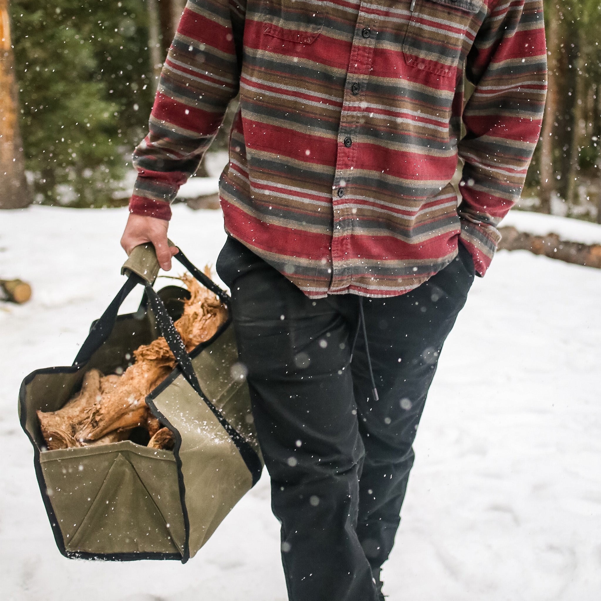 Tote Shape Log Carrier olive outdoors in the snow