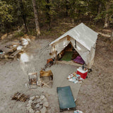 alpha wall tent set up with camping equipment