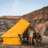 10 regatta bell tent tuscan sun in front of mountain with couple enjoying with their dog