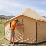 18 altimus bell tent with flaps being closed by a man outdoors