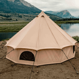 Regatta bell tent sandstone beige rear view set up in front of a lake and having mountains in background