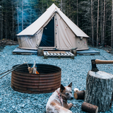 Regatta Bell Tent sandstone beige with a campfire and dog in front