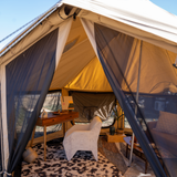 altimus bell tent being used for glamping with furniture placed inside