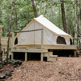 avalon bell tent setup on platform in the woods