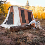 cabin tent camping trip with huskey