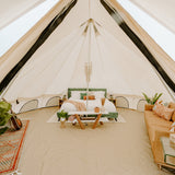 20 avalon bell tent view from inside with furniture being used for glamping