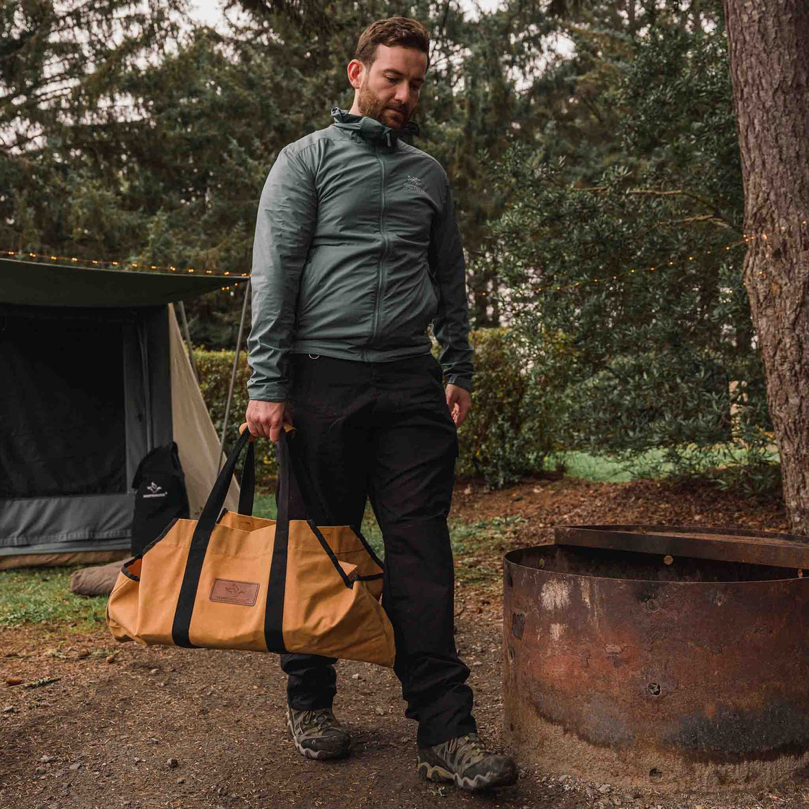 Boat-Shape-Canvas-Firewood-Log-Carrier-tan being carried outdoors