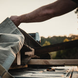 Canvas tarp being used to store wood