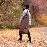 Hoplite Canvas Top Load Bag brown color being carried by a woman