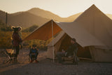 Bell tent awning placed outdoors with a regatta bell tent and family sitting under it